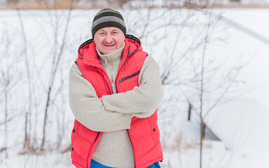 Lifestyle of older man on retired, senior man at winter snowy day at nature, recreation concept