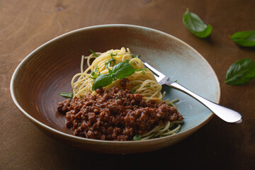 Bolognese pasta with fresh basil