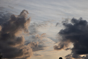 Scattered clouds at sunset golden sky