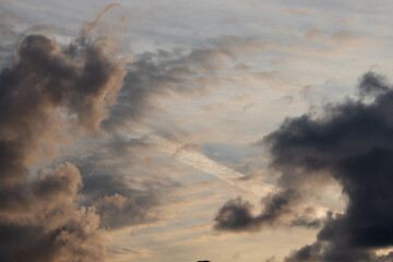 Scattered clouds at sunset golden sky