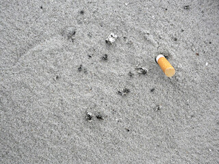 The rest of cigarettes in sand ashtray