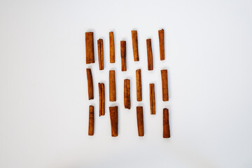 Cinnamon sticks square on white background. Spice