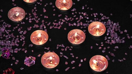 Relaxing spa decor, burning candles and decorative stones