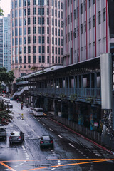 Elevated view of a Makati street and its elevated covered walkway on a wet day. Urban Landscape.