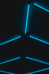Blue fluorescent lamps  mounted on a brick wall. A gas charged luminaire. Background image,...