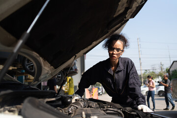 Fototapeta na wymiar Automotive Technician Auto Repair Service.Brazilians do industry in the transportation business.car engine maintenance mechanic