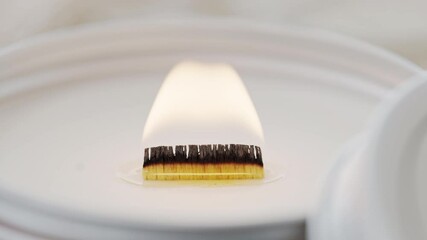 Close up of self made burning candle shot in 4k super slow motion
