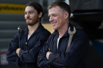 Mechanic changing engine, service car workshop automobile. Professional Man Team Shop Maintenance