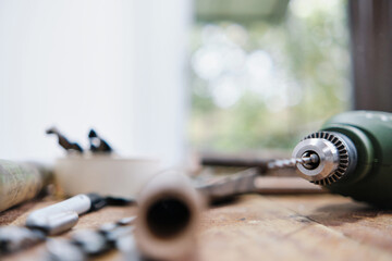 drill on workbench with bokeh background