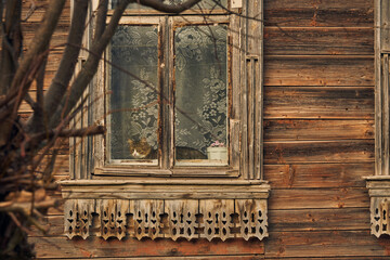 An old wooden house with carved platbands.