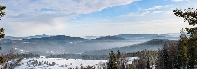 Panorama of winter foggy landscape of Beski Sadecki mountain range