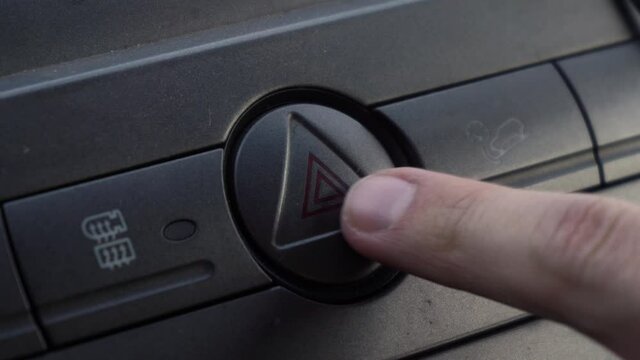 a man presses the emergency button in case of an accident