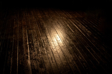 Spot of light on plank painted wooden floor background