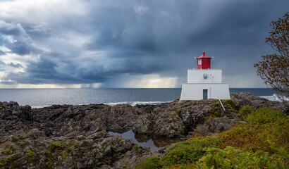 Fototapeta na wymiar Stormclouds at Amphitrite Point Lighthouse