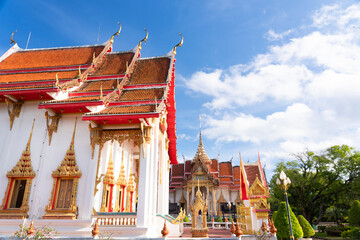 Naklejka premium thai temple Wat chalong Buddhist landmark of Phuket with cloud and famous travel in Thailand