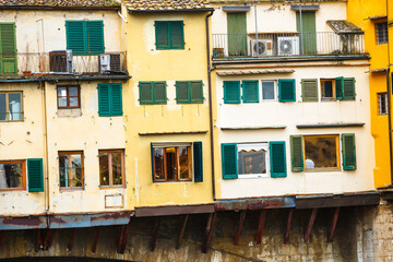 Fototapeta na wymiar Detales of Ponte Vecchio, Florence, Italy. Windows, balconies, flowers