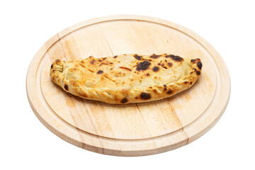Traditional closed italian pizza calzone on wooden plate  isolated on white background. Concept for advertising flyer and poster for restaurants or pizzerias. File contains clipping path.
