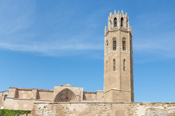 tower of the cathedral of lerida on a blue sky - obrazy, fototapety, plakaty
