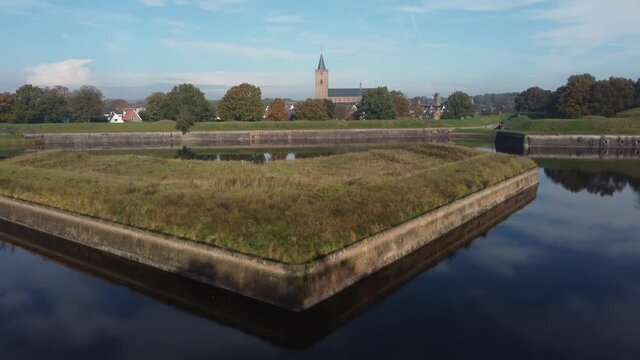 Fortress City Naarden Vesting in The Netherlands With Church and beautiful water reflections on a windless day, Aerial UP
