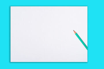 Green pencil sticking from the right side of a white background with light blue edges