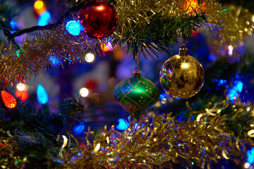 Obraz na płótnie Canvas Ornamental Christmas Baubles on Tree. Festive decorations on a Christmas tree.