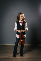 Young girl closeup studio portrait with violin