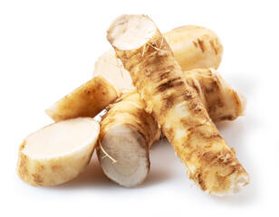 Horseradish roots close up isolated on white background.