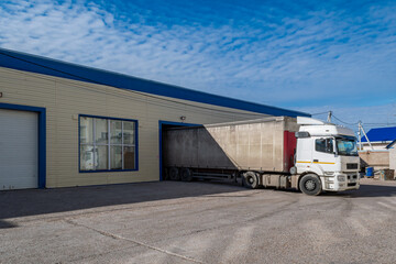 A large lorry stands at the terminal for loading and unloading goods and cargo