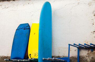 surfing boards on a white wall