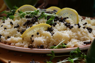 Couscous porridge with sprouts, sativa hemp seeds, lemon and wine