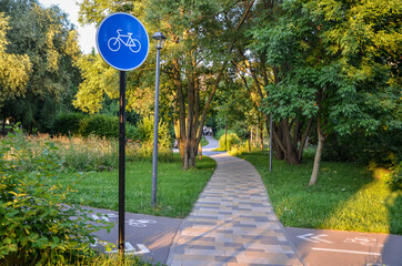 bike path sign in city park. Alerting pedestrians about movement of cyclists. Cycling infrastructure
