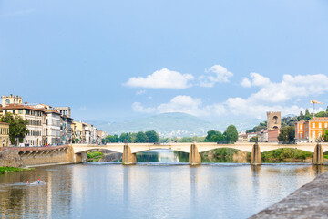 Panoramic view of Ponte alle Grazie, Florence, Italy. Spring cloudy day