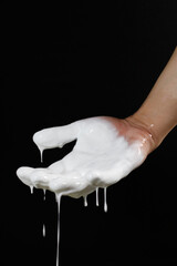 an open palm with a flowing liquid