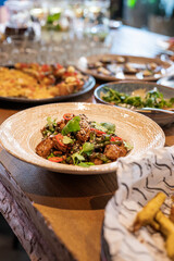 dish salad in a plate with beef meat on a plate in a restaurant