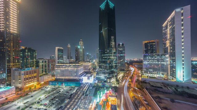 Dubai International Financial district aerial night timelapse. Panoramic view of business and financial office towers.