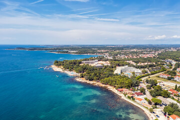 Fototapeta na wymiar An aerial view of coastline and beaches in Porec, Istria, Croatia