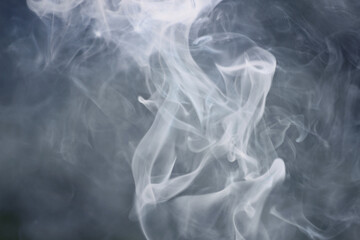white smoke on a dark background