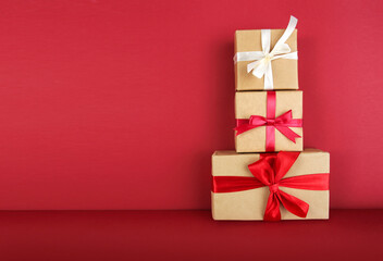 Gift boxes set on red background. Christmas holiday presents. Parcel delivery.