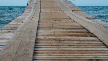 old pier going into the sea 