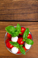 Caprese salad in glass. Studio Photo.