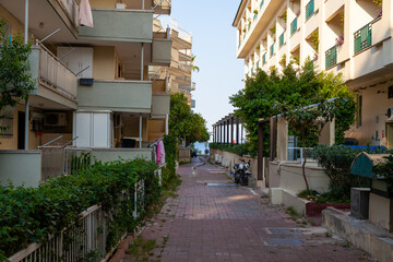 Fototapeta na wymiar Turkey streets of the city cobbled pavement road tunnel spring green near hotels