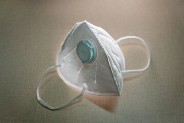 KN95 Industrial disposable ear loop labor protection mask isolated on the table



