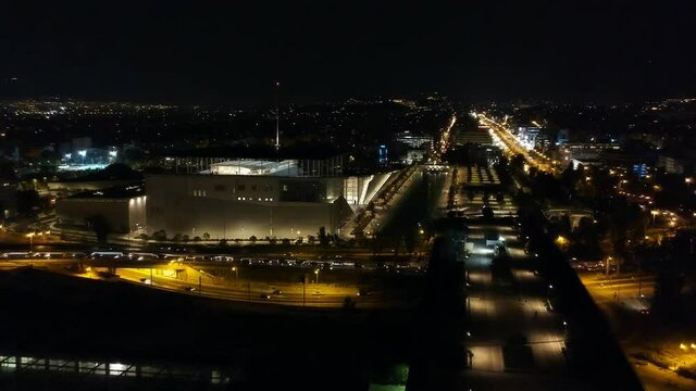 Aerial cityscape view of southern Athens at night.