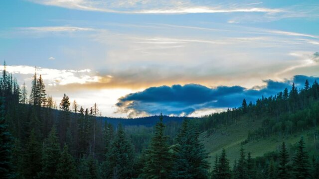Lockdown Time Lapse Beautiful Shot Of Green Trees In Forest Against Cloudy Sky During Sunset - Creede, Colorado