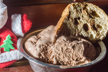 chocolate panettone with chocolate ice cream, christmas concept with copy space