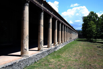 Colonnade of the Great Palestra in the green, Pompeii, Campania, Italy