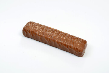 sweet and tasty chocolate bar isolated on white