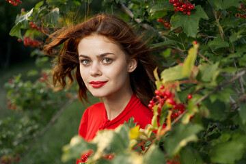 Naklejka premium Beautiful woman fresh air summer berries nature