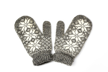 Winter woolen mittens with a pattern isolated on a white background. Winter accessory. Flat lay, top view.