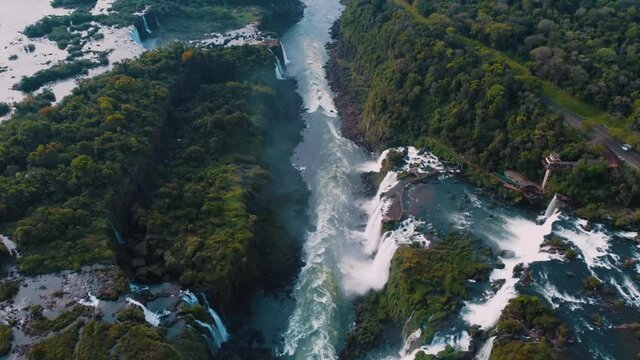 Beautiful aerial view of the Iguaçu Falls from a helicopter, one of the Seven Natural Wonders of the World. Foz do Iguaçu, Paraná, Brazil. 4K.